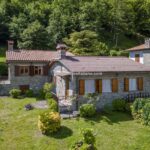 View showing garden and Tuscan villas for sale