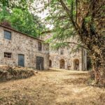 External view of Italian country home and barn