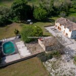 Aerial view of country home, pool and garden. Cingoli Marche Italy