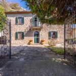View showing entrance and facade of stone house in Chiusi della Verna Tuscany Italy